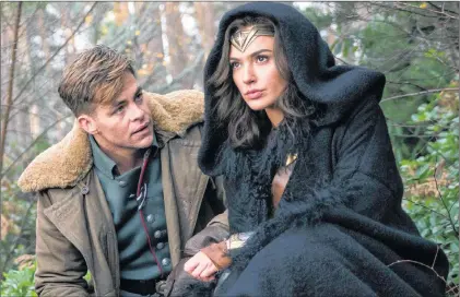  ?? AP PHOTO ?? This image released by Warner Bros. Pictures shows Chris Pine, left, and Gal Gadot in a scene from, “Wonder Woman.” It is one of the smash hits in a weak summer at the box office.