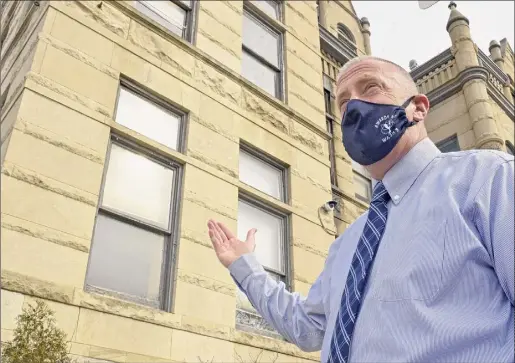  ?? Photos by Lori Van Buren / Times Union ?? Cohoes Mayor William Keeler talks about the top pane of the left window falling out of Cohoes City Hall on Wednesday.