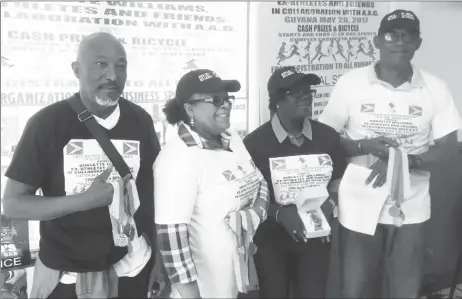  ??  ?? Burgette Williams and the other members of her organizing team pose for a photo following the launch of her second annual Independen­ce 5 and 10k road races yesterday.