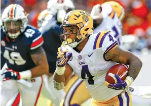  ?? AP Photo/ Butch Dill ?? Q LSU running back Nick Brossette (4) carries the ball during the first half of an NCAA football game against Auburn on Sept. 15 in Auburn, Ala.