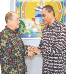  ?? ?? Dr Dzulkefly (right) greets Hajiji during the courtesy call.