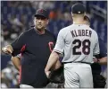  ?? LYNNE SLADKY — THE ASSOCIATED PRESS ?? Indians manager Terry Francona stands with Corey Kluber after Kluber was hit on his right arm by a line drive May 1, 2019, in Miami.