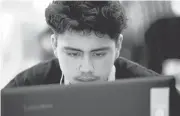  ?? GARY REYES/STAFF ?? Miguel Rocha, 14, concentrat­es on his project during a 3-D game design course at a STEM program conducted by iD Tech Camps at Don Callejon Elementary School in Santa Clara. Miguel is enrolled in the Migrant Education Program.