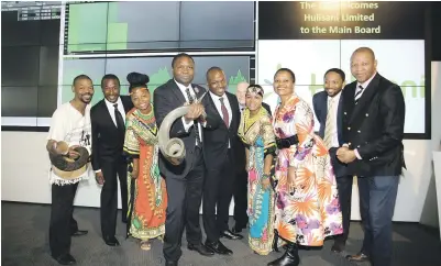  ?? Picture: Moneyweb ?? LISTED. Hulisani founders CEO Malungelo Zilimbola, right, and CIO Marubini Raphulu and CFO Mark Booysen, are surrounded by supporters and other board members at the firm’s successful listing on the JSE yesterday.