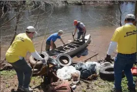  ?? MEDIANEWS GROUP FILE PHOTO ?? More than 50 volunteers from sponsors Superior Tube Company and Dow Chemical Company worked together to clean the Perkiomen Creek in Collegevil­le on April 12, 2014.