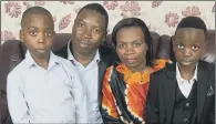  ??  ?? Faustin Rukundo with his wife Violette Uwamahoro, and her sons Sam, eight and David, 10.