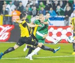  ??  ?? MACCABI HAIFA forward Yaniv Katan (in green) scores his team’s first goal in last night’s 4-1 win over Beitar Jerusalem at Kiryat Eliezer Stadium.