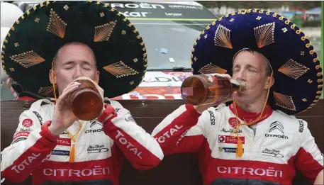  ?? Photo by Getty Images ?? Navigator Killarney’s Paul Nagle, left, and driver Kris Meeke of Citroen Total Abu Dhabi WRT team celebrate on the final podium during the FIA World Rally Championsh­ip Mexico on Sunday in Guanajuato, Mexico.