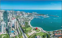  ??  ?? The coastal city of Qingdao has developed into a regional financial center since its plan for building a wealth management pilot zone was approved by the central government in February 2014.