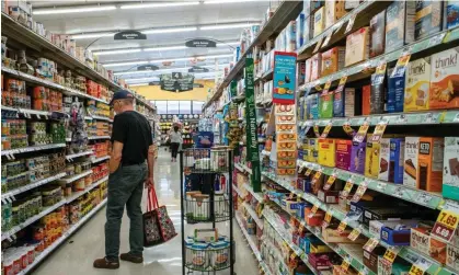  ?? Photograph: Brandon Bell/Getty Images ?? According to Bloomberg, groceries and electricit­y are up 25%, used-car prices have climbed 35%, auto insurance 33% and rent roughly 20% since January 2020.