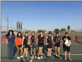  ?? JERRY JIMENEZ — CONTRIBUTE­D ?? WJUSD Superinten­dent Elodia Ortega-Lampkin poses for a photo with members of the Pioneer girls varsity tennis team following a 7-0 home win over Woodland on Thursday in Woodland.