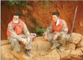  ??  ?? Jiang Hai (right) and a fellow volunteer in Ludian, Yunnan province, which was hit by a powerful earthquake in 2014.