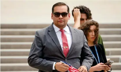  ?? Photograph: John Minchillo/AP ?? George Santos departs federal court in Central Islip, New York, in June.