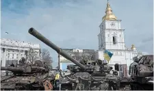  ?? ANDREW KRAVCHENKO THE ASSOCIATED PRESS ?? Destroyed Russian tanks and armoured vehicles sit near the
St. Michael’s Cathedral in downtown Kyiv, Ukraine, on Sunday.