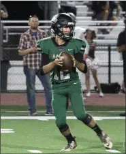  ?? MIKE BUSH/NEWS-SENTINEL ?? Liberty Ranch quarterbac­k Matthew Hopper drops back in the Hawks' non-league game against Bear River on Sept. 7.