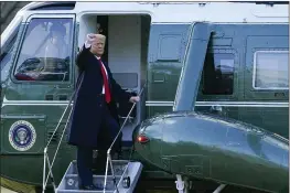  ?? ALEX BRANDON — THE ASSOCIATED PRESS ?? President Donald Trump gestures as he boards Marine One on the South Lawn of the White House in Washington on Wednesday. Trump is en route to his Mar-a-Lago Florida Resort.