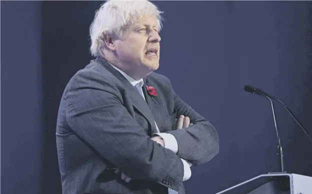  ?? Picture: Oli Scarff/afp via Getty Images ?? ↑ Boris Johnson speaks during a press conference at the COP26 climate change summit.