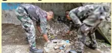  ??  ?? Military photo released to the regional newspaper Mindanao Examiner show soldiers and cops cleaning streets in the besieged city of Marawi in southern Philippine­s.