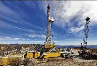  ?? IRFAN KHAN / LOS ANGELES TIMES 2015 ?? A relief well is drilled in 2015 at the Aliso Canyon natural gas storage facility after a massive leak was discovered that led to the evacuation of many residents of a neighborho­od in Los Angeles. Although cleaner than coal, natural gas is a fossil...