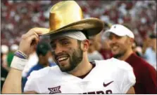  ?? RON JENKINS — THE ASSOCIATED PRESS FILE ?? Oklahoma quarterbac­k Baker Mayfield will be the first quarterbac­k to finish in the top four of the Heisman Trophy balloting three times, and he’s favored to claim the award on Saturday.