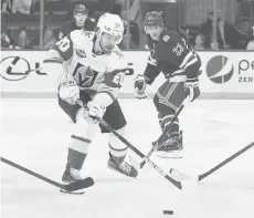  ?? MARY ALTAFFER/AP ?? Vegas Golden Knights center Chandler Stephenson controls the puck ahead of Rangers defenseman Adam Fox (23) in the second period Friday at Madison Square Garden in New York.