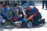  ??  ?? A rescue task force member tends to an “injured concert-goer” at the Toyota Amphitheat­er during a largescale active shooter training last week.