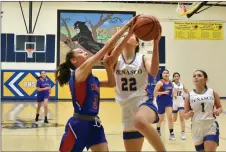  ?? JEANS PINEDA/Taos News ?? MacAuley gets fouled on the elbow by 8th-grader Isabella Archuleta.