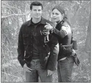  ??  ?? David Boreanaz and Emily Deschanel are shown in 2006 in a scene from the second season of Bones. The long-running series comes to an end at 8 p.m. March 28 on Fox.