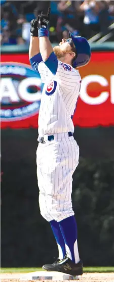  ?? DAVID BANKS/ AP ?? Ben Zobrist reacts after hitting a two- run double that cut the Cubs’ deficit to 7- 6 in the eighth inning Saturday.