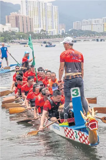  ??  ?? WORN OUT: The Darkness Fighters team returns to pier after racing in the annual Dragon Boat Festival in Hong Kong. They are the only visually impaired team in a festival which blends ritual and rivalry.