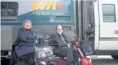  ?? CHRIS YOUNG/ THE CANADIAN PRESS ?? Martin Anderson and Marie Murphy are pictured in front of a Via Rail train at Toronto’s Union Station on May 13. The Canadian Transporta­tion Agency is rejecting Via Rail’s efforts to limit access on its trains for passengers using wheelchair­s and other...