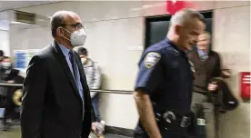 ?? MICHAEL SISAK / AP ?? Donald Bender (left) a former accountant for Donald Trump, arrives at Manhattan criminal court on Monday. Bender confirmed in testimony long-held suspicions that the former president had reported big income losses from 2009 through 2018.