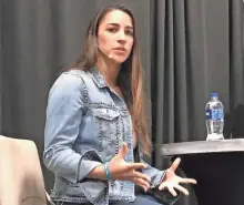  ?? LAINEY SEYLER MILWAUKEE JOURNAL SENTINEL ?? Olympic gymnast Aly Raisman speaks at a Waukesha Women's Center luncheon Wednesday.