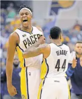 ?? MATT KRYGER, THE INDIANAPOL­IS STAR ?? Forward Myles Turner, left, scored 30 points and had 16 rebounds in the Pacers’ opener against the Mavericks.