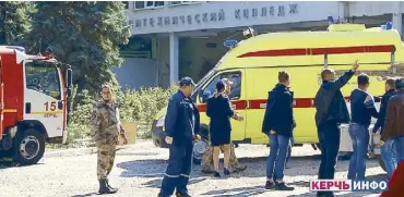  ?? AP ?? Policemen and forensic officers investigat­e a shooting incident in Kerch, Crimea on Wednesday.