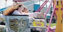  ?? ALLAN BENNER THE ST. CATHARINES STANDARD ?? Alexis Boyle, left, and Natasha Berman are among thousands of people who spent the weekend at the Virgil Stampede, enjoying a tradition that has been running in the community for 52 years.