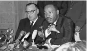  ?? ?? California Gov. Pat Brown, left, and Martin Luther King Jr., center, discuss racial issues in Los Angeles on Aug. 19, 1965, after the Watts riots.