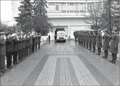  ?? AP ?? Turkish and Russian army officers salute Monday as a funeral car carrying the coffin of Russian Lt. Col. Oleg Peshkov leaves after a ceremony at the Gulhane Military Medical Academy in Ankara, Turkey.