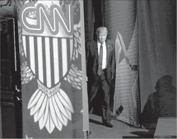  ?? Darren Hauck Getty Images ?? PRESIDENT TRUMP’S alleged demand that CNN be sold as a condition of the AT&T-Time Warner deal has been taken as an artifact of Trump’s war with CNN over its reporting on his administra­tion.