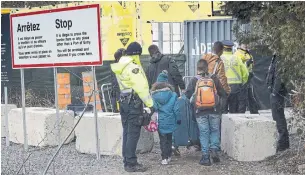  ?? PAUL CHIASSON THE CANADIAN PRESS ?? According to the city of Toronto, 40 per cent of people staying at city-run shelters are refugees.