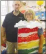  ?? (NWA Democrat-Gazette/ Susan Holland) ?? Sulphur Springs Mayor Shane
Weber (left) takes a photo with Renee Wall, librarian at Gamble Elementary School in Centerton at the celebratio­n.