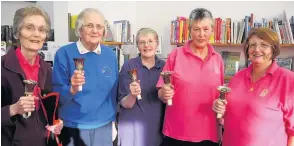  ??  ?? Musical entertainm­ent Bell ringers (from left) Jean MacInnes, Margaret Davidson, Irene Duncan, Mary McGregor and Reta Mitchelson performed in Coupar Angus Library on Saturday