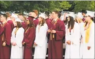  ?? Luther Turmelle / Hearst Connecticu­t Media ?? Members of the 2018 Sheehan High School graduating class stand and sing the school song at their graduation ceremony on Friday.