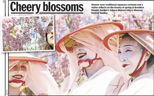  ??  ?? Women wear traditiona­l Japanese costume and a visitor reflects on the beauty of spring at Brooklyn Botanic Garden’s Sakura Matsuri cherry blossom festival Sunday.