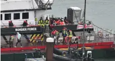  ?? AFP ?? Migrants arrive in the UK after being rescued in the Channel