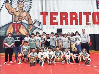  ?? Contribute­d Photo ?? Pepperell wrestlers and coaches pose for a team photo after clinching a berth to Class A State Duals with a pair of wins at prelims on Saturday at Irwin County.