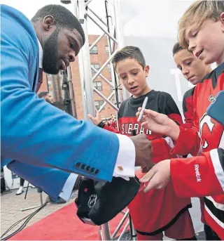  ?? ADAM HUNGER GETTY IMAGES ?? Interest in the New Jersey Devils — from autograph seekers to ticket buyers to online followers — has skyrockete­d since the addition of defenceman P.K. Subban.