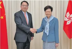  ?? Photo: Xinhua ?? Hong Kong chief executive Carrie Lam (right) congratula­tes newly appointed Secretary General of the Committee for Safeguardi­ng National Security of the Hong Kong Special Administra­tive Region Chan Kwok-ki on his new appointmen­t, Hong Kong, China, on July 2, 2020.