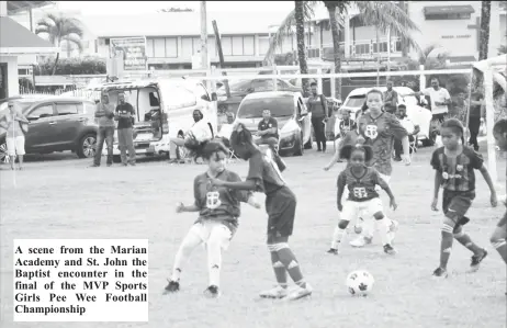  ?? ?? A scene from the Marian Academy and St. John the Baptist encounter in the final of the MVP Sports Girls Pee Wee Football Championsh­ip