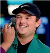  ??  ?? Masters golf champion Patrick Reed gets some make-up before a CNBC television interview.